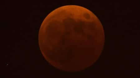 A red tinged moon seen during a total lunar eclipse